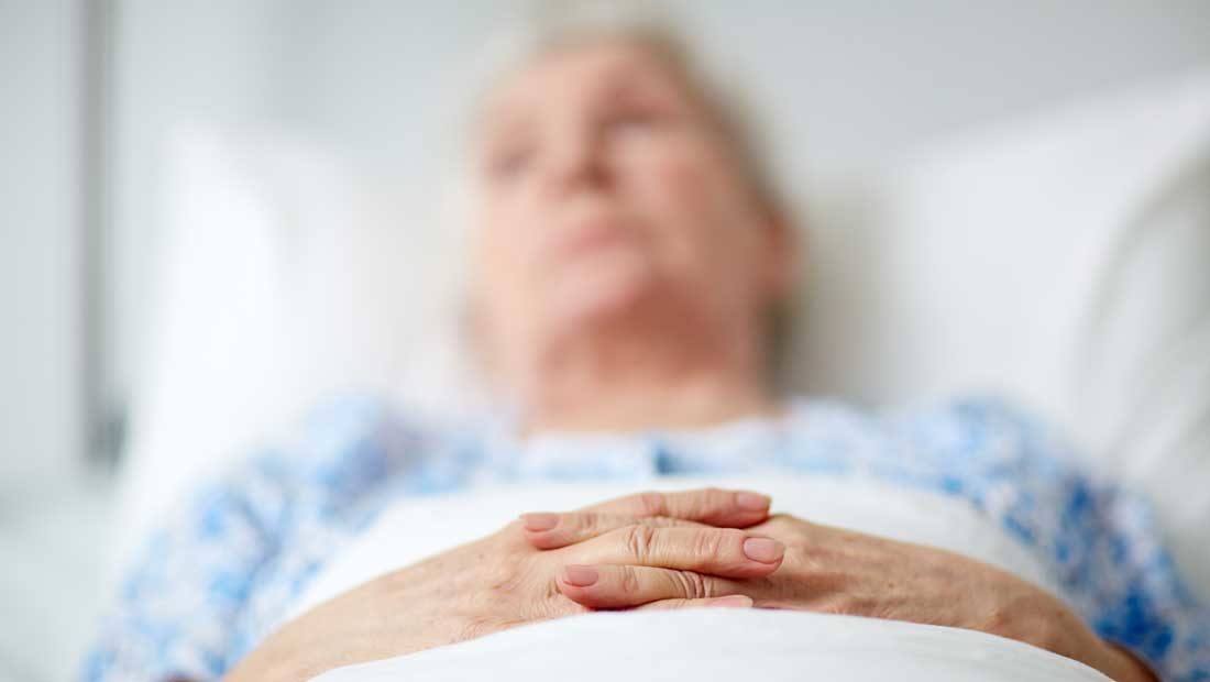 elderly woman in a hospital bed