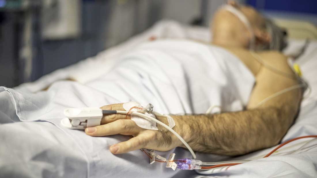 critical care patient in hospital bed