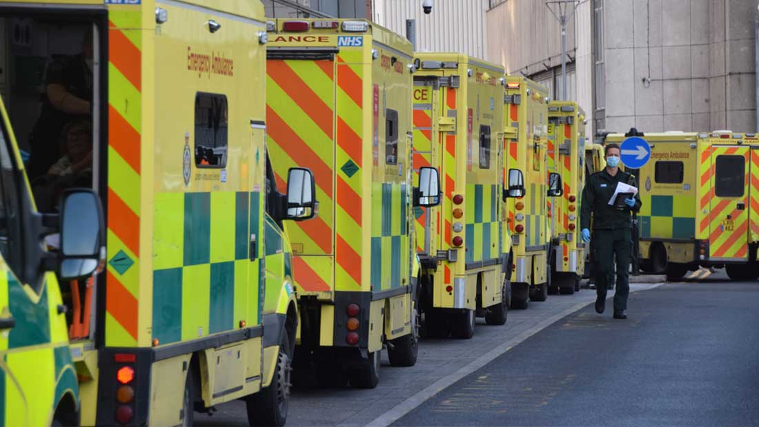 NHS ambulances queuing outside a hospital